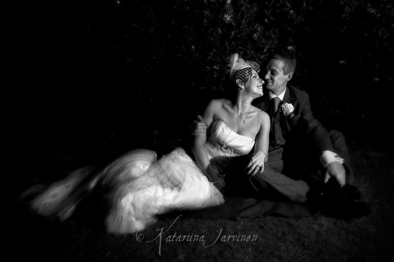 _MG_6937BW bride and groom sitting on grass - black and white wedding portrait